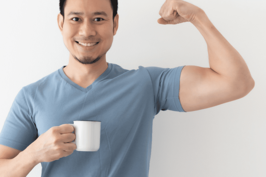 An asian man holding a white cup and showing his strong arm